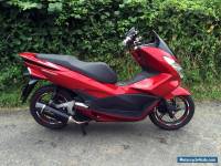 2015 Honda PCX 125cc Scooter in Red with Leo Vince Exhaust and other extras.