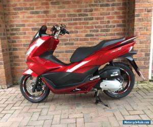 Motorcycle 2015 Honda PCX 125cc Scooter in Red with Leo Vince Exhaust and other extras. for Sale